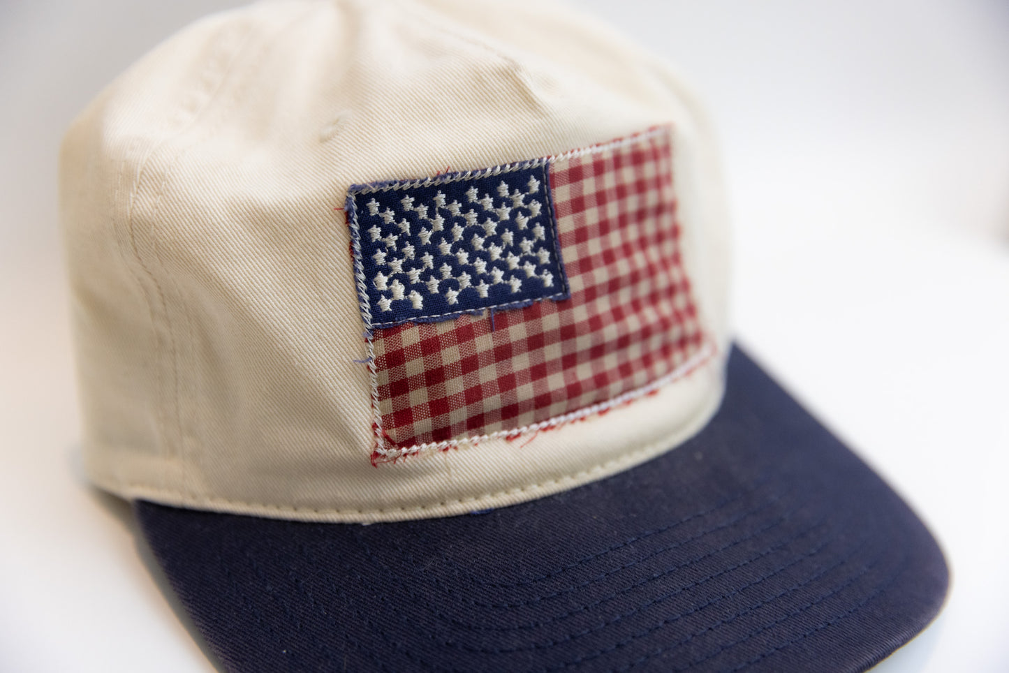 Cap with American flag patch on a white background