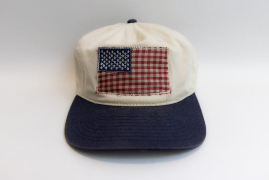 Cap with American flag patch on a white background