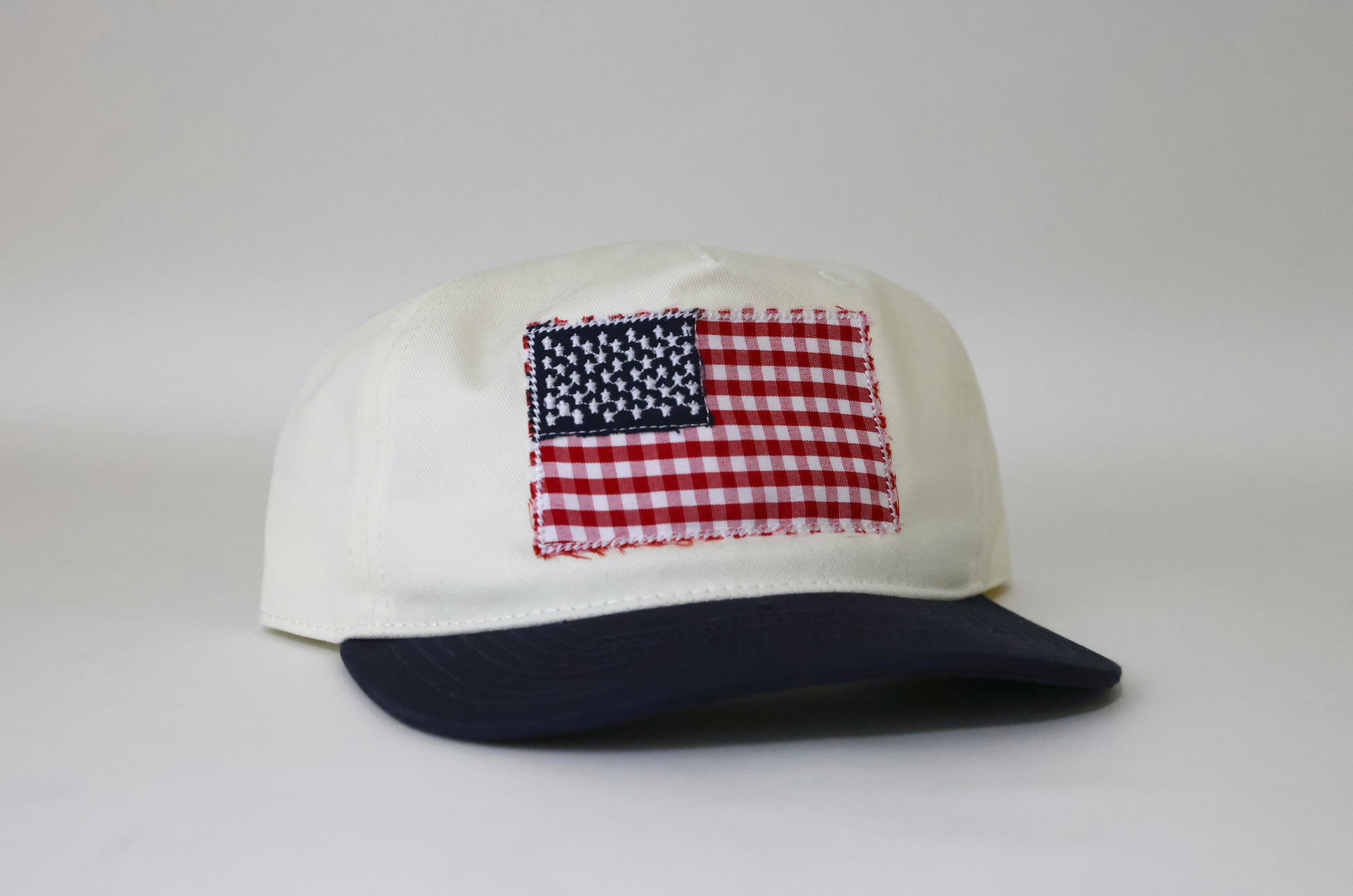 Cap with American flag patch on a white background