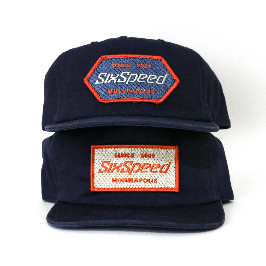 Embroidered Patches Sewn onto navy hats